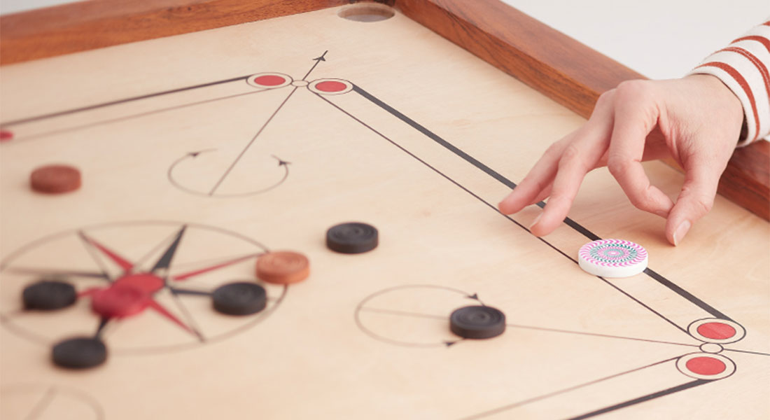 Discover The Ancient Game of Carrom - Uber Games