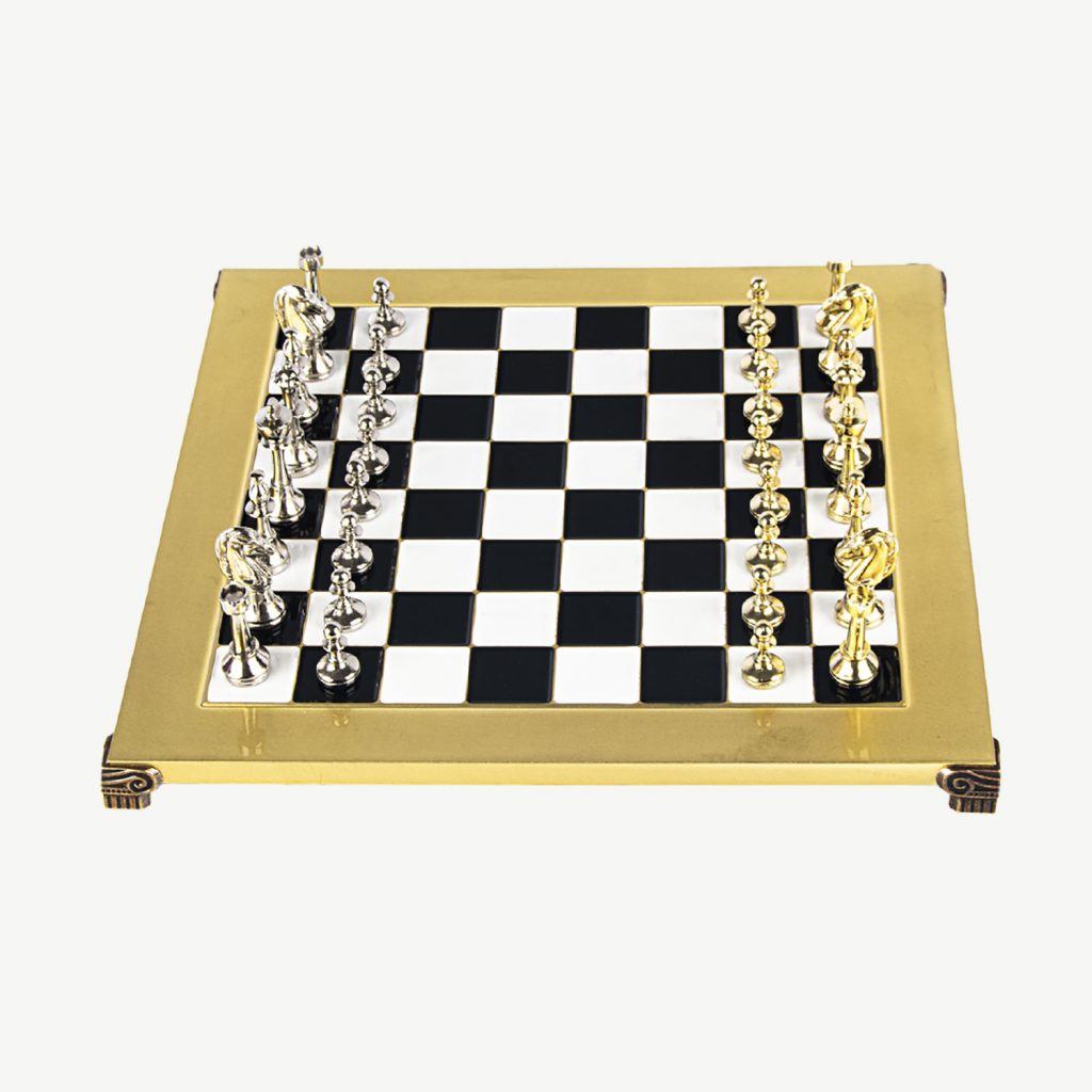 A beautiful Classic but luxurious Chess set that will honour any wonderful home or office.

ABOUT MANOPOULOS - Manopoulos, a renowned Greek manufacturer, specialises in creating exquisite Board Game sets that have gained global recognition. They have been handcrafting quality board games since 1970. Their exceptional wooden sets seamlessly blend elegant design with sturdy construction, providing an unmatched gaming experience.

PREMIUM METAL STAUNTON CHESS SET & BOARD - The Staunton chess pieces are named after Howard Staunton who was widely considered to be one of the best players in the world. The knight, the most intricate and distinct piece of any chess set, is a realistically carved horse head. The Staunton Knight was likely inspired by a sculpture on the east pediment of the Parthenon. The Metal Staunton by Manopoulos reinforces this architectural history of the original pieces while respecting their timeless design.

MATERIALS :  The Metal Chess Board is made from Brass and looks modern, smart & prestigious. The Chessmen are made from Zinc Alloy and present in silver and gold colours.

DIMENSIONS – Wooden Box is (14-inch x 14-inch) 36cm x 36cm. Total Set Weight 5 kg.

SET INCLUDES - 32 Chessmen & Board , Wooden case for Storage and includes a Manopoulos gift box so can be given as a present of gift.